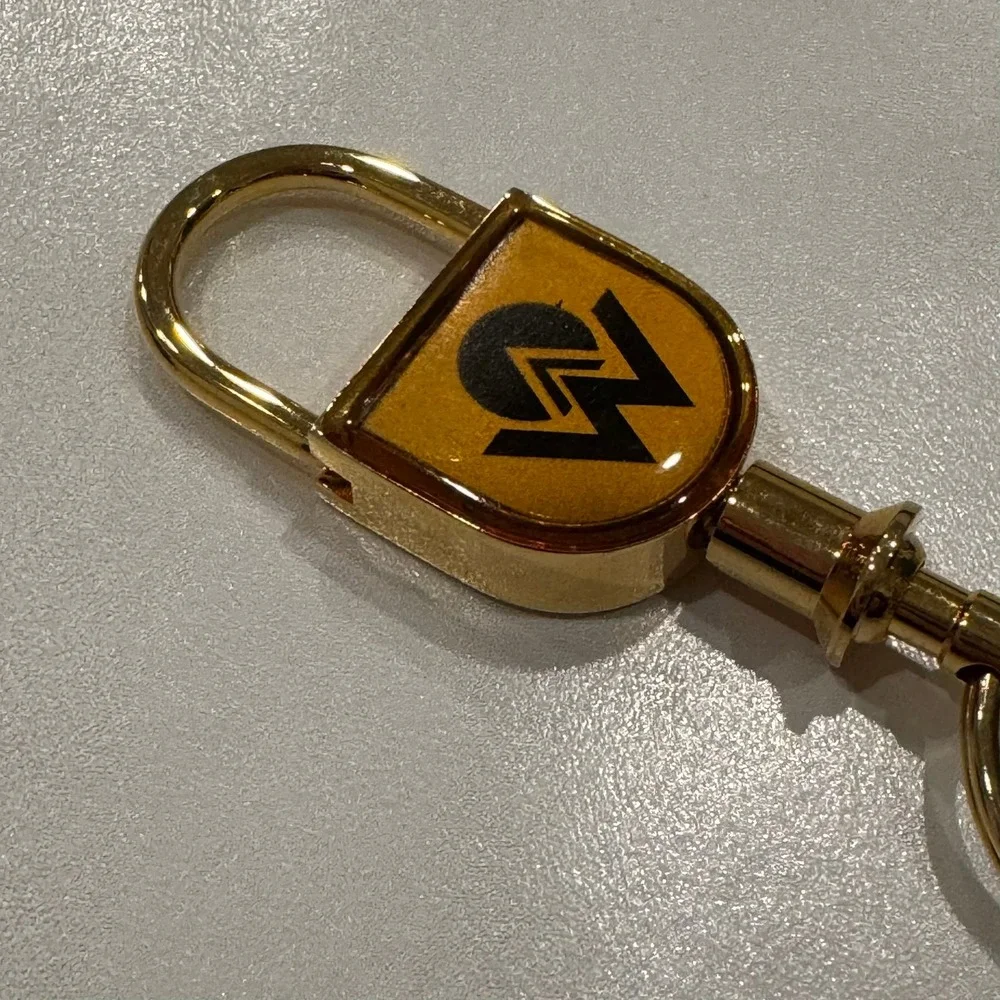 Gold Tone Lock Charm‎ Keychain With Embossed Logo